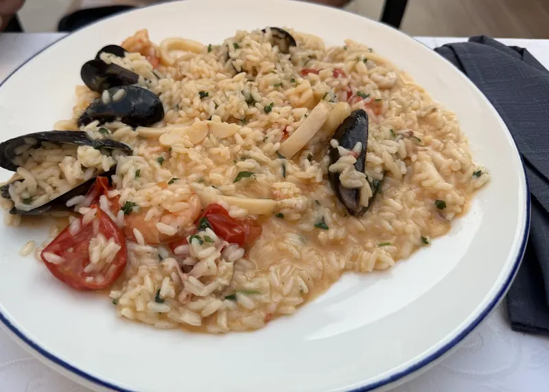 Seafood risotto with mussels and cherry tomatoes